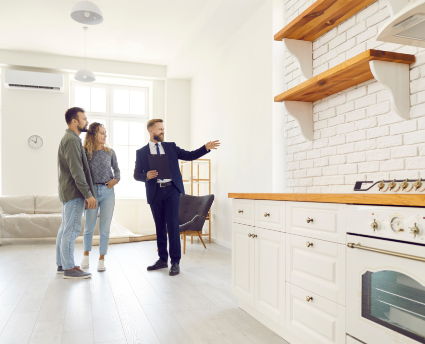 realtor showing home to couple