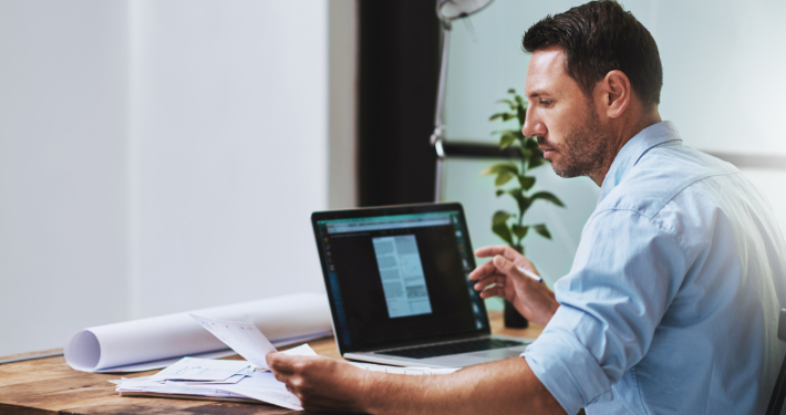 Side view of a property manager on computer